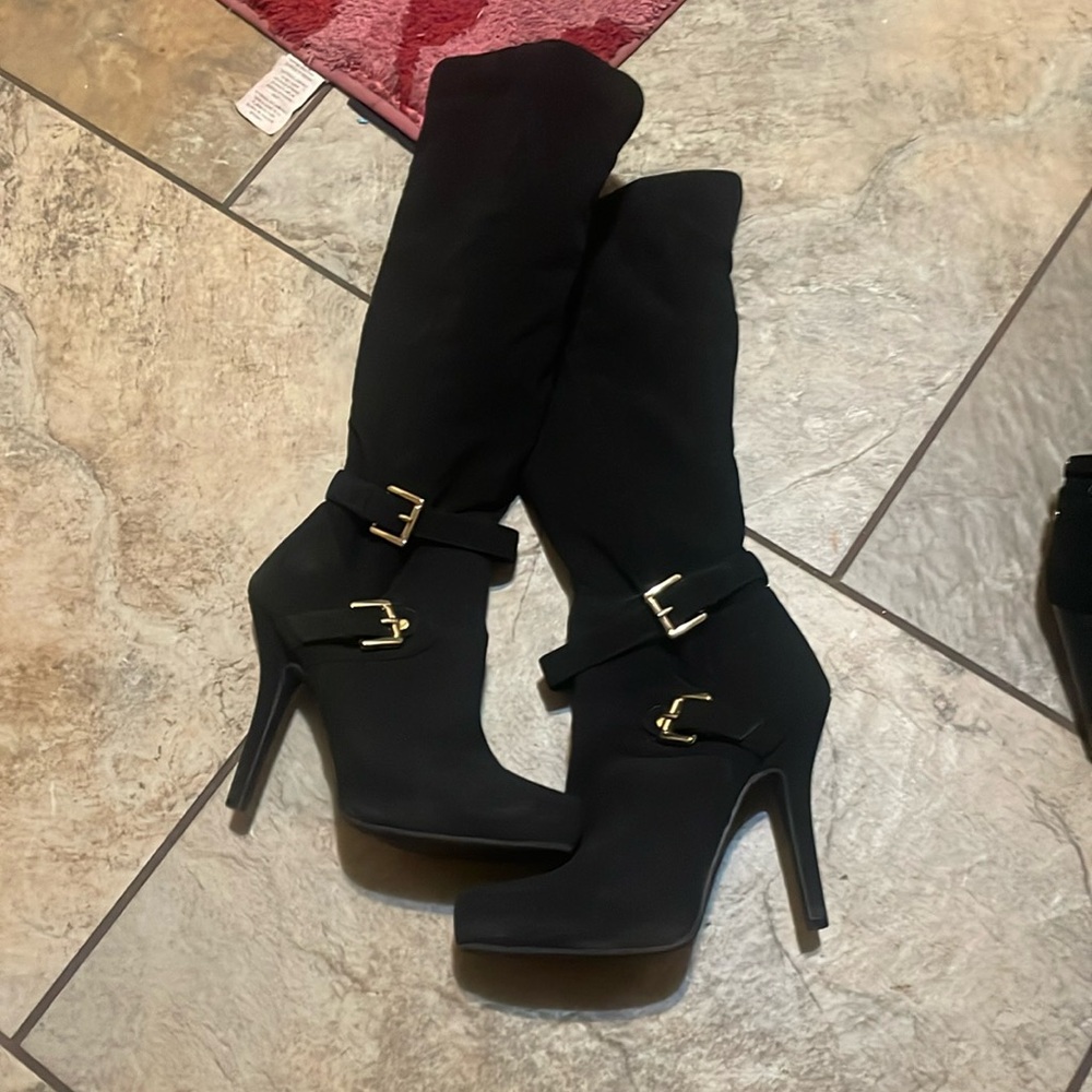 Tall high heel boots size 7.5 black boots with gold buckle  and zips in the side